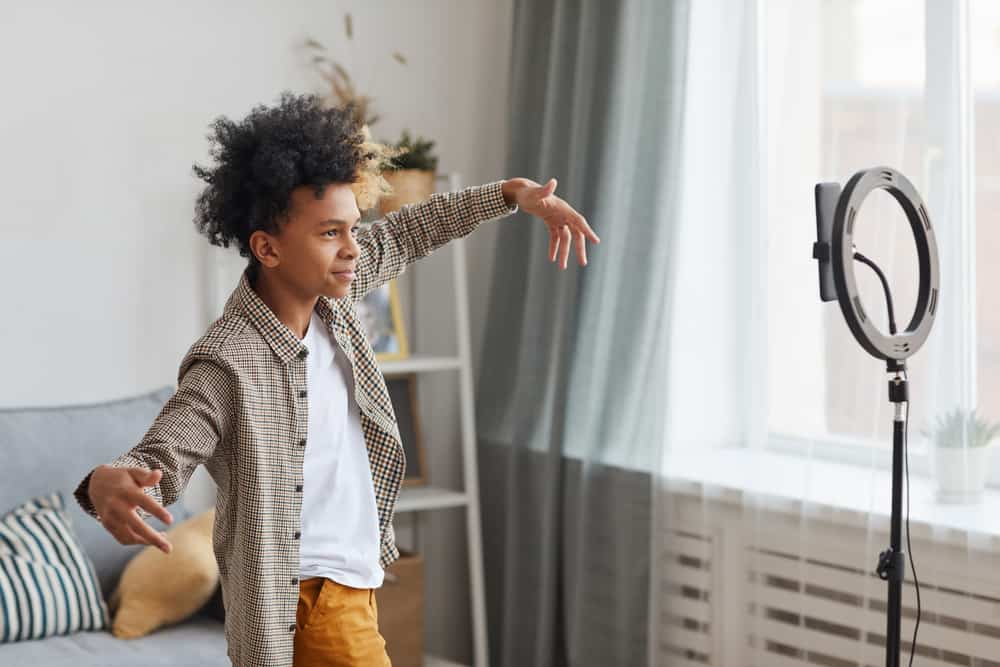 A teenager filming a video